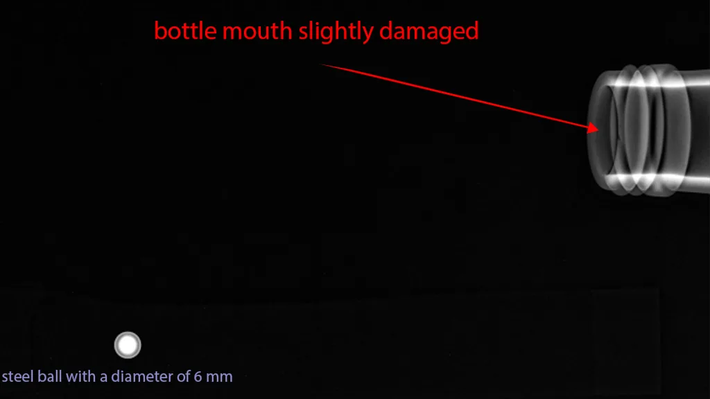 X-ray image of a slightly damaged bottle mouth under the cap